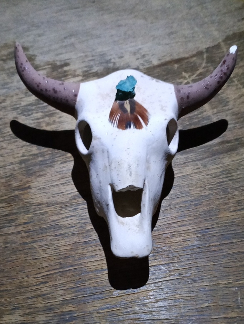 Decorative Bull Skull Wall Accent in White with Brown Horns and Teal Detail
